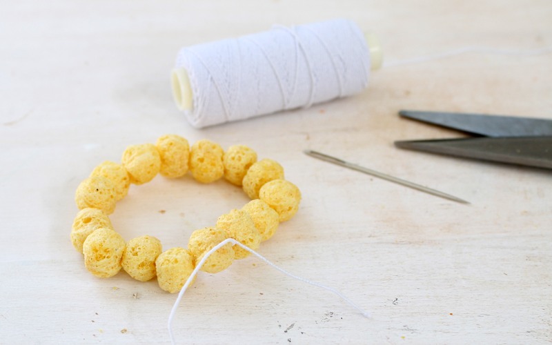 tie ends of elastic cord for kix cereal bracelets