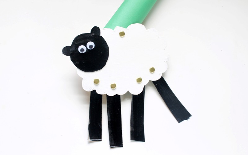Attach lamb puppet to cardboard tube with fastener