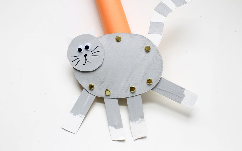 Attach cat puppet to cardboard tube with fastener