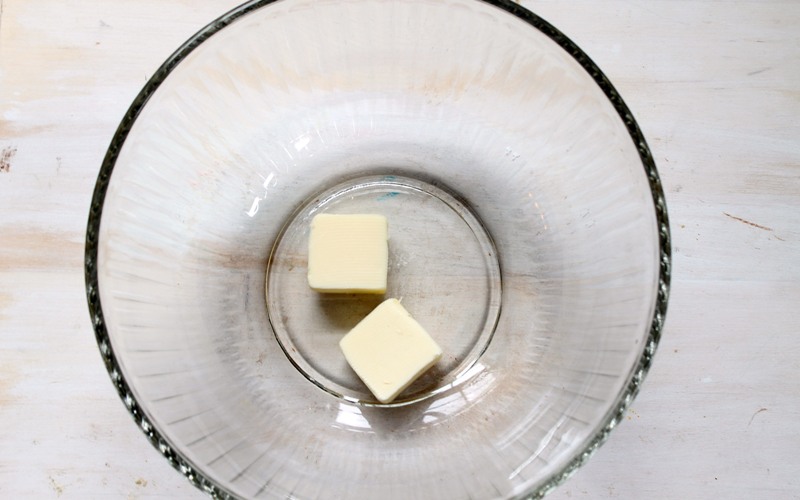 Melt butter in microwave-safe bowl