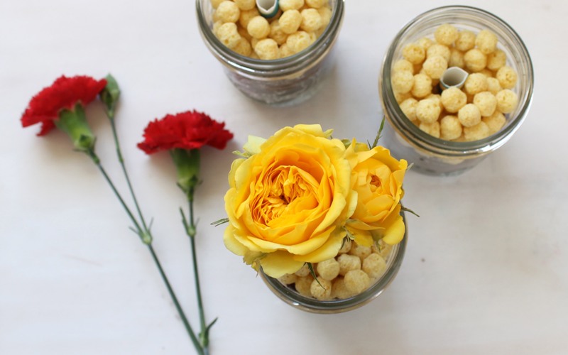 Place food safe flowers into straws