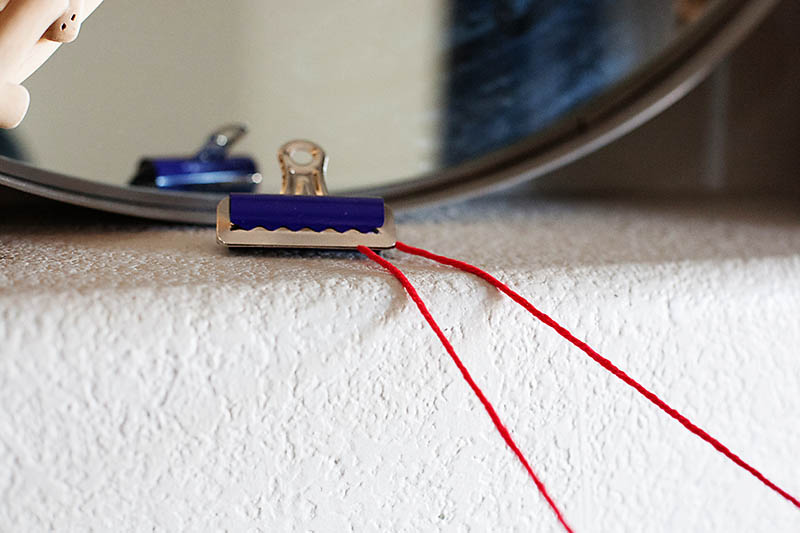 use clips to secure yarn to furniture