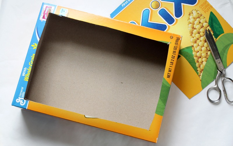 Tape top of box and cut hole 
