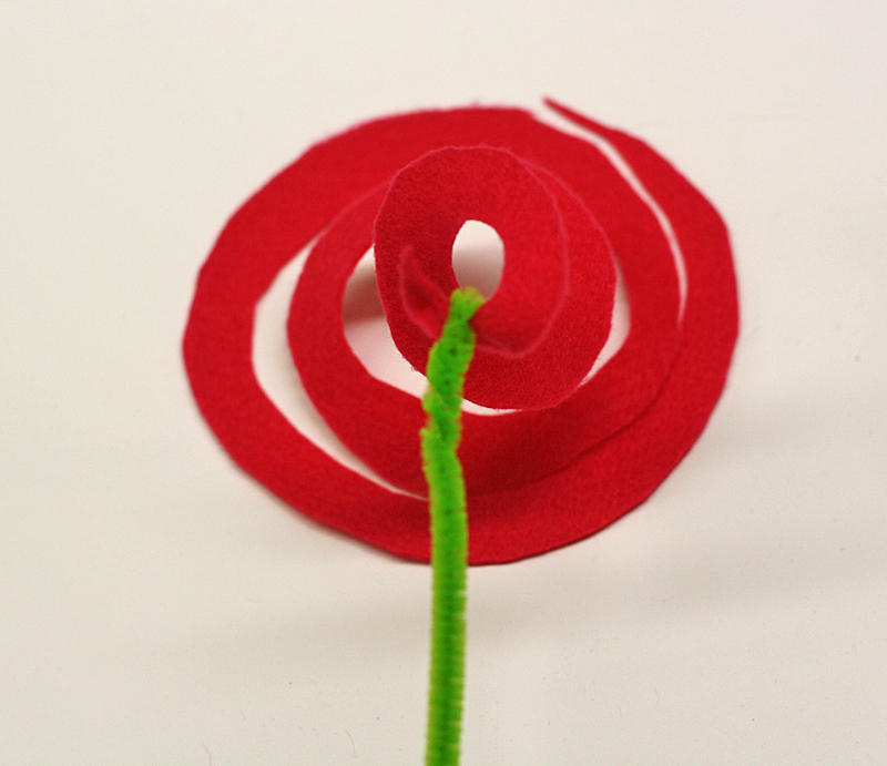 tie green pipe cleaner to red felt