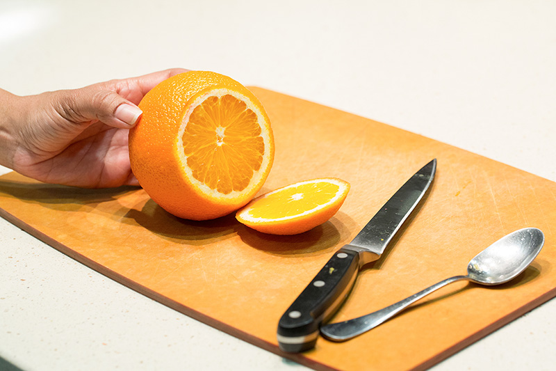 Slice the top of a medium size orange