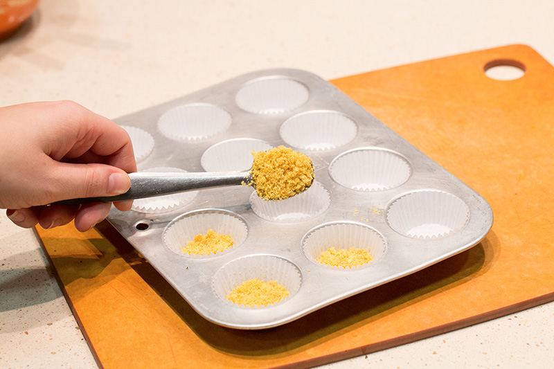 Fill mini muffin cups with crushed Kix mixture.
