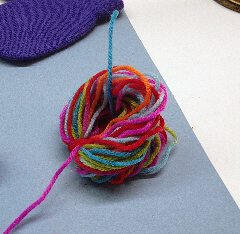 Loop yarn into a knot