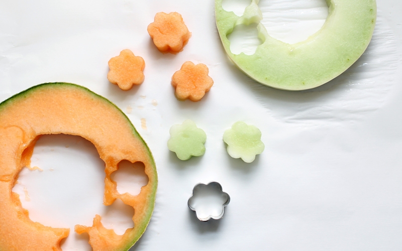 Cut shapes from cantaloupe and honey dew melons