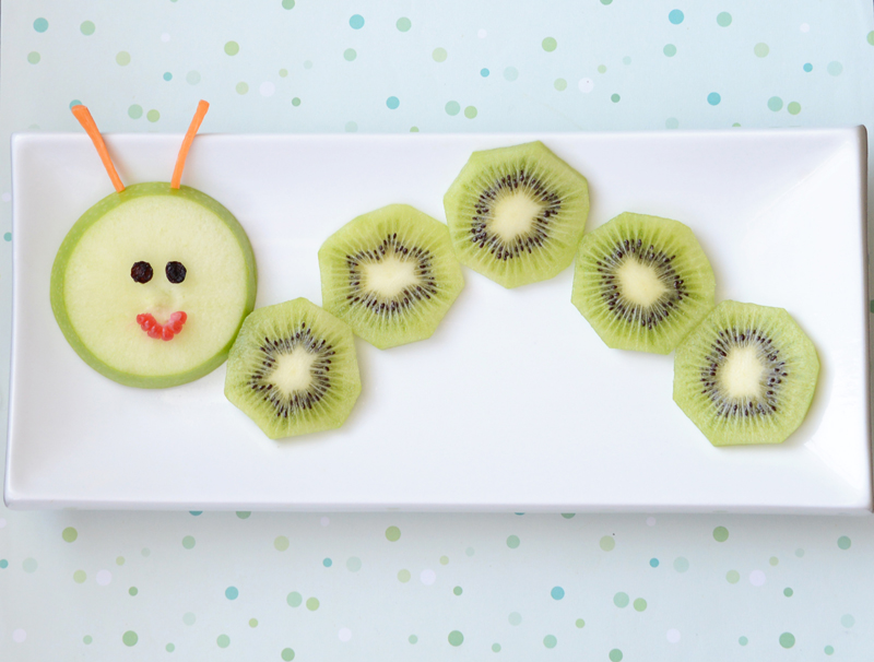 add fruit pieces for the caterpillar face