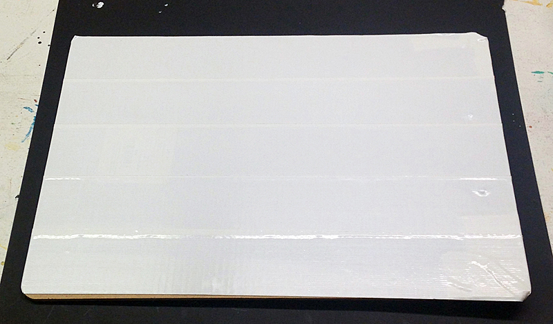 cover the back of the clipboard with white tape