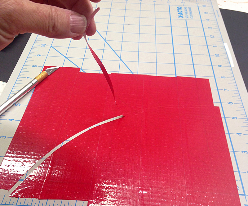 cut and peel a curved line from the red tape