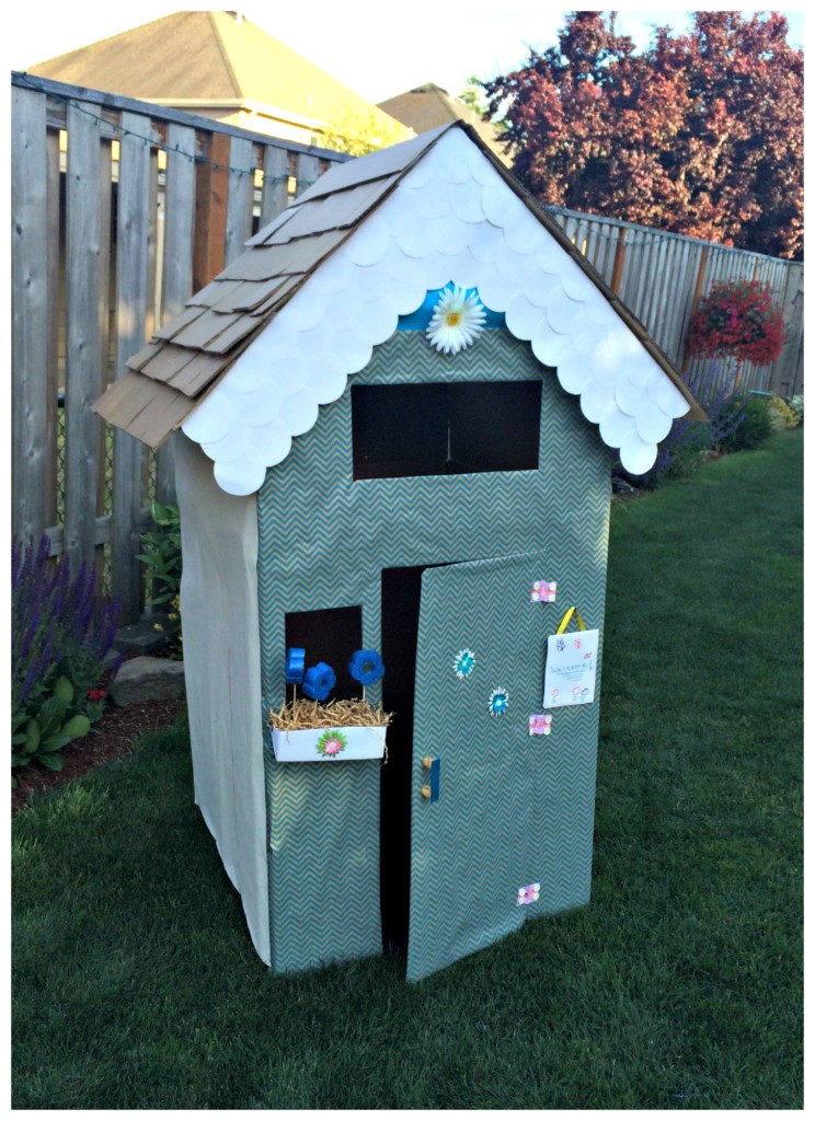 Create an adorable playhouse from cardboard boxes